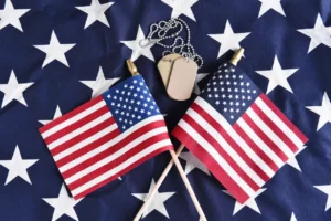 American flags and dog tags on stars background.
